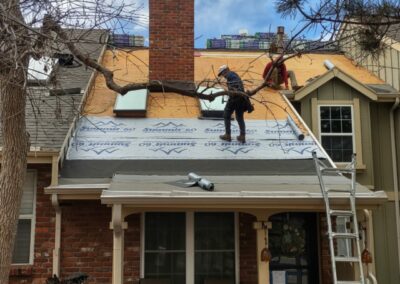 Contractors replacing roof in Parker Colorado and flashing around skylights